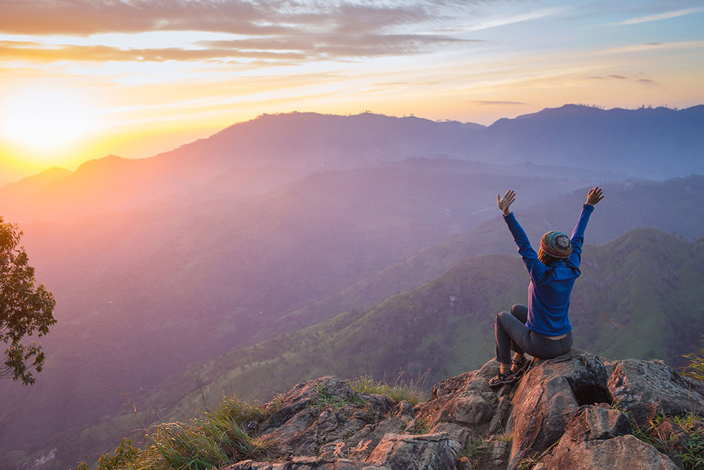 successful lady on mountain